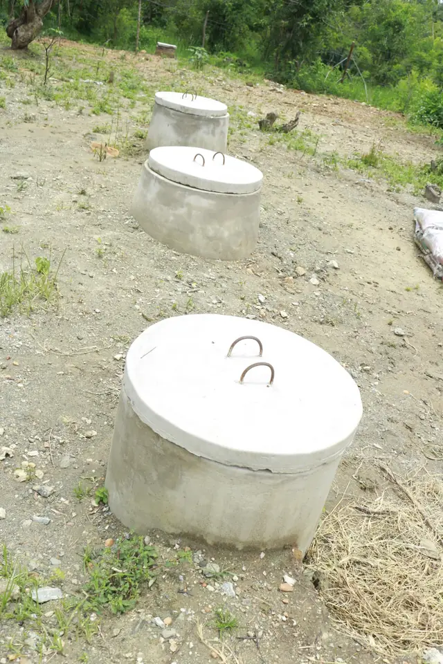 The domed covers of an underground biogas digester