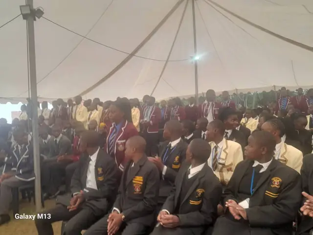 School prefects in blazers seated in a marquee during leadership training