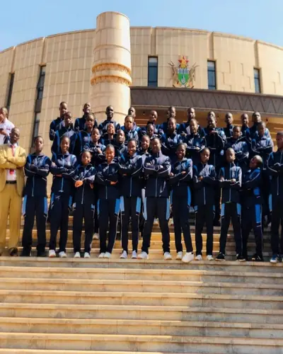 Students in navy uniforms gathered on the steps of the Parliament building